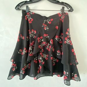 Bardot Black Ruffle Mini Skirt with Red Flowers.